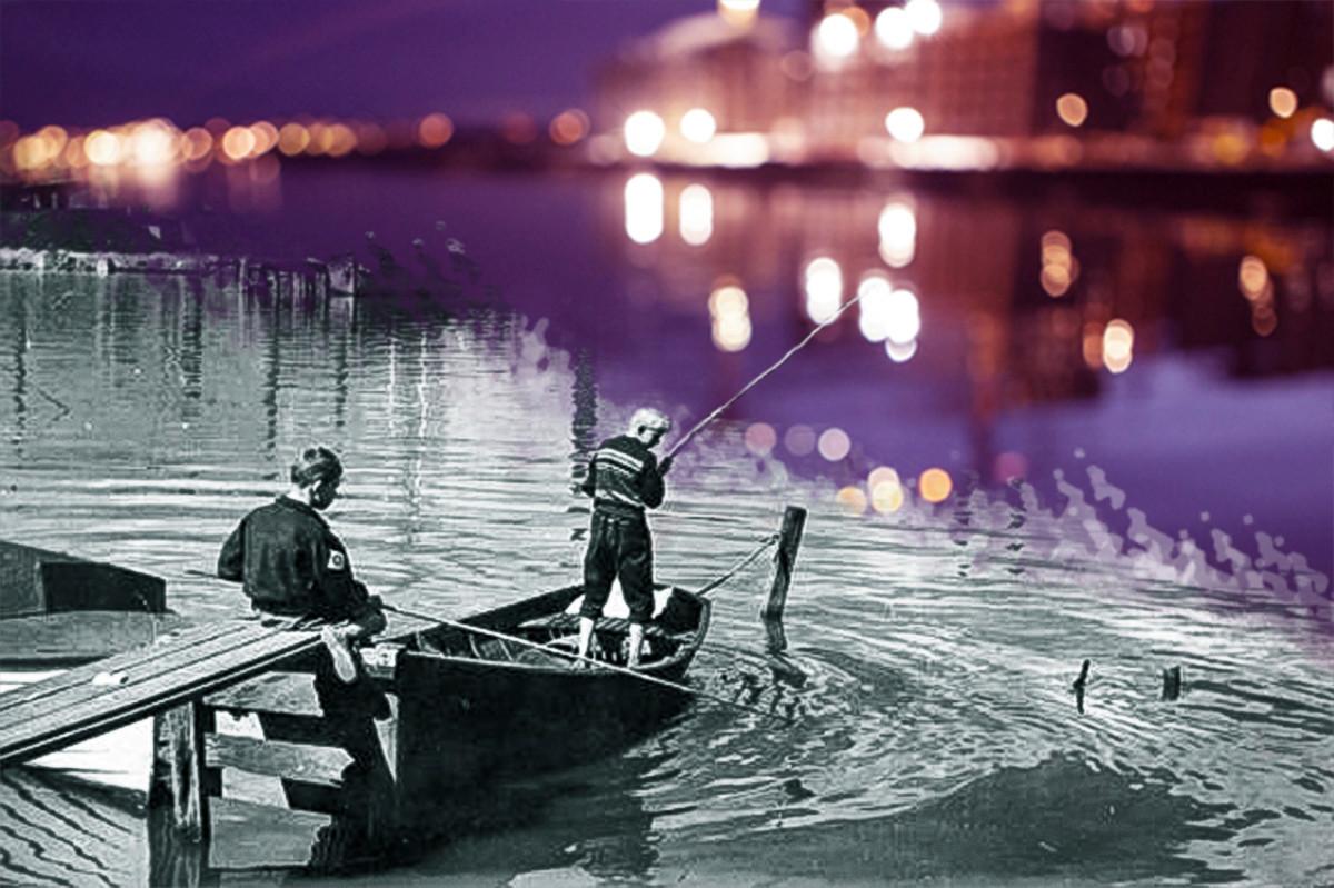Kaksi poikaa kalasti Sörnäisten satama-alueella 1950-luvulla. Kalasataman kaupunginosa on rakennettu vanhan sataman päälle.